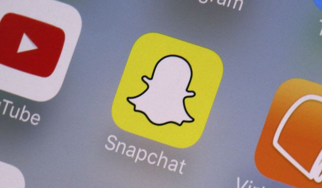 The Snapchat app is seen on a mobile device in New York, Aug. 9, 2017. (AP Photo/Richard Drew, File)