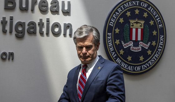 FBI Director Christopher A. Wray speaks to journalists at the Omaha FBI office on Wednesday, Aug. 10, 2022. Wray addressed threats made to law enforcement after agents raided Trump&#39;s Mar-a-Lago residence in Palm Beach, Fla. (Chris Machian/Omaha World-Herald via AP) ** FILE **