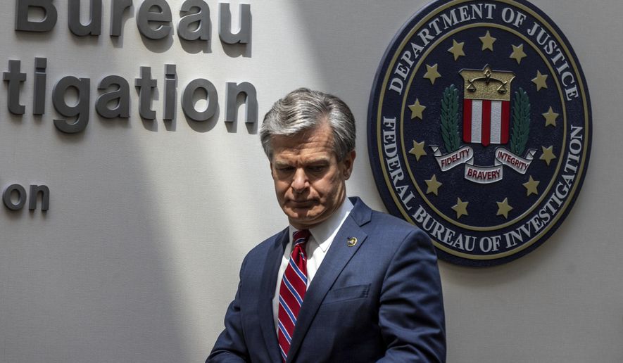 FBI Director Christopher A. Wray speaks to journalists at the Omaha FBI office on Wednesday, Aug. 10, 2022. Wray addressed threats made to law enforcement after agents raided Trump&#x27;s Mar-a-Lago residence in Palm Beach, Fla. (Chris Machian/Omaha World-Herald via AP) ** FILE **