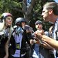 In this April 27, 2017 file photo, demonstrators, sharing opposing views, argue during a rally in Berkeley, Calif., near the University of California campus, to show support for free speech and to condemn the views of Ann Coulter and her supporters. Coulter&#39;s speech was cancelled. (AP Photo/Marcio Jose Sanchez, File)
