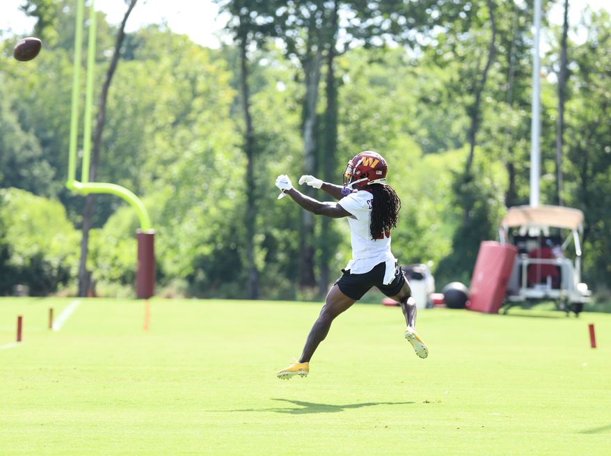 Washington Commanders Wide Reciever Marken Michel (19) jumps to make a catch during training camp at The Park in Ashburn VA on August 11th 2022. (Photo: Alyssa Howell)