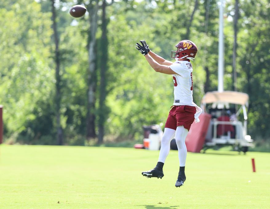 Washington Commanders Wide Reciever Dax Milne (15) leaps to complete the pass at during training camp at The Park in Ashburn VA on August 11th 2022. (Photo: Alyssa Howell)