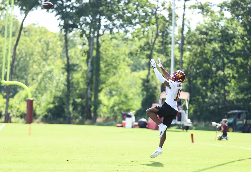 Washington Commanders Wide Reciever Matt Cole (18) leaps to catch the pass at during training camp at The Park in Ashburn VA on August 11th 2022. (Photo: Alyssa Howell)