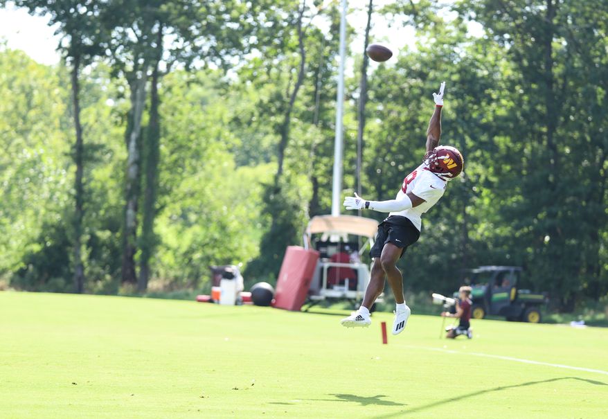 Washington Commanders Wide Reciever Matt Cole (18) leaps to catch the pass at during training camp at The Park in Ashburn VA on August 11th 2022. (Photo: Alyssa Howell)