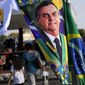 A banner emblazoned with an image of Brazil&#39;s President Jair Bolsonaro, who is a candidate for reelection, is displayed for sale in Brasilia, Brazil, Aug. 2, 2022. Almost half a century later to the day, thousands are expected to rally on Aug. 11, for the readings of two documents inspired by the original “Letter to the Brazilians”. Both new manifestos defend the nation&#39;s democratic institutions and electronic voting system, which Bolsonaro has relentlessly attacked ahead of his reelection bid. (AP Photo/Eraldo Peres, File)