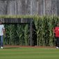 Ken Griffey Jr., left, and his father Jen Griffey Sr., walk on to the field before a baseball game between the Cincinnati Reds and Chicago Cubs at the Field of Dreams movie site, Thursday, Aug. 11, 2022, in Dyersville, Iowa. (AP Photo/Charlie Neibergall)