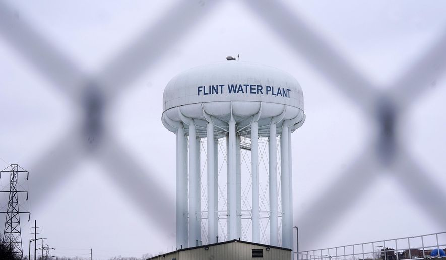 FILE - The Flint water plant tower is seen on Jan. 6, 2022, in Flint, Mich. A judge declared a mistrial Thursday, Aug. 11, after jurors said they couldn&#39;t reach a verdict in a dispute over whether two engineering firms should bear some responsibility for Flint&#39;s lead-contaminated water. Four families accused Veolia North America and Lockwood, Andrews &amp;amp; Newman, known as LAN, of not doing enough to get Flint to treat the highly corrosive water or to urge a return to a regional water supplier. (AP Photo/Carlos Osorio, File)