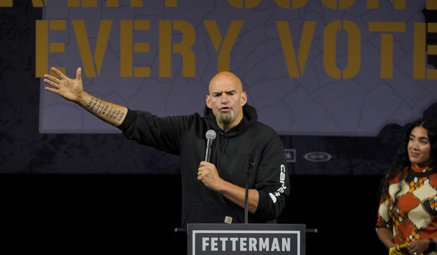 Pennsylvania Lt. Gov. John Fetterman, the Democratic nominee for the state&#39;s U.S. Senate seat, speaks after being introduced by his wife Gisele Barreto Fetterman, right, during a rally in Erie, Pa., on Friday, Aug. 12, 2022. (AP Photo/Gene J. Puskar)