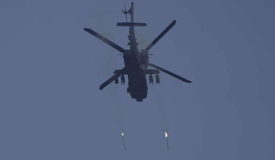 A U.S. Army AH-64 Apache attack helicopter fires rockets to engage a target during Super Garuda Shield 2022 joint military exercises in Baturaja, South Sumatra, Indonesia, Friday, Aug. 12, 2022. The United States and Indonesian militaries conducted the annual combat exercises on Indonesia&#39;s Sumatra island, joined for the first time by participants from other partner nations including Australia, Japan and Singapore, signaling stronger ties amid growing maritime activity by China in the Indo-Pacific region. (AP Photo/Dita Alangkara) **FILE**
