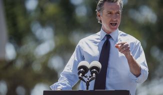 California Governor Gavin Newsom speaks at the Chabot Space &amp; Science Center in Oakland, Calif., on Friday, Aug. 12, 2022 (Ethan Swope/San Francisco Chronicle via AP)