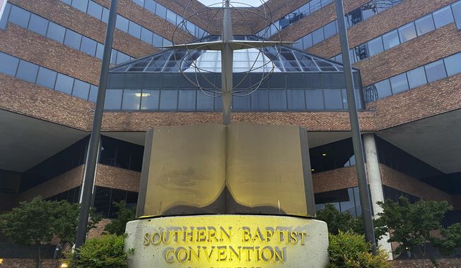 A cross and Bible sculpture stand outside the Southern Baptist Convention headquarters in Nashville, Tenn., on May 24, 2022. The Executive Committee of the Southern Baptist Convention said Friday, Aug. 12, 2022, that several of the denomination&#x27;s major entities are under investigation by the U.S. Department of Justice. (AP Photo/Holly Meyer, File)