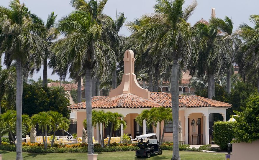 Security moves in a golf cart at former President Donald Trump&#39;s Mar-a-Lago estate, Tuesday, Aug. 9, 2022, in Palm Beach, Fla. The FBI searched Trump&#39;s Mar-a-Lago estate as part of an investigation into whether he took classified records from the White House to his Florida residence, people familiar with the matter said Monday. (AP Photo/Lynne Sladky)