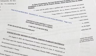 The motion by the Justice Department to the U.S. District Court South District of Florida to unseal the search warrant the FBI received before searching the Florida estate of former President Donald Trump, is photographed Thursday, Aug. 11, 2022. Attorney General Merrick Garland cited the &amp;quot;substantial public interest in this matter&amp;quot; in announcing the request. (AP Photo/Jon Elswick)