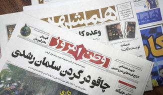 The front pages of the Aug. 13 edition of the Iranian newspapers, Vatan-e Emrooz, front, with title reading in Farsi: &amp;quot;Knife in the neck of Salman Rushdie,&amp;quot; and Hamshahri, rear, with title: &amp;quot;Attack on writer of Satanic Verses,&amp;quot; are pictured in Tehran Saturday, Aug. 13, 2022. Rushdie, whose novel “The Satanic Verses” drew death threats from Iran’s leader in the 1980s, was stabbed in the neck and abdomen Friday by a man who rushed the stage as the author was about to give a lecture in western New York. (AP Photo/Vahid Salemi)