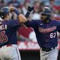 Minnesota Twins&#39; Gilberto Celestino (67) celebrates with Gio Urshela (15) after hitting a home run during the second inning of a baseball game in Anaheim, Calif., Friday, Aug. 12, 2022. Urshela also scored. (AP Photo/Ashley Landis)