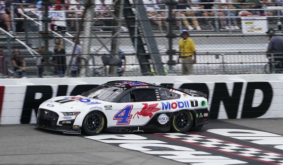 Kevin Harvick (4) crosses the start/finish line during a NASCAR Cup Series auto race at Richmond Raceway, Sunday, Aug. 14, 2022, in Richmond, Va. (AP Photo/Steve Helber)