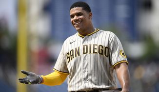 San Diego Padres&#39; Juan Soto reacts at first base during the ninth inning of a baseball game against the Washington Nationals, Sunday, Aug. 14, 2022, in Washington. (AP Photo/Nick Wass)