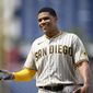 San Diego Padres&#x27; Juan Soto reacts at first base during the ninth inning of a baseball game against the Washington Nationals, Sunday, Aug. 14, 2022, in Washington. (AP Photo/Nick Wass)
