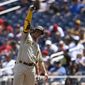 San Diego Padres&#x27; Juan Soto gestures after he singled during the third inning of a baseball game against the Washington Nationals, Sunday, Aug. 14, 2022, in Washington. (AP Photo/Nick Wass)