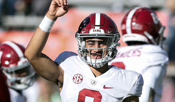 Alabama quarterback Bryce Young (9) during warm ups before the start of an NCAA college football game against Auburn Saturday, Nov. 27, 2021, in Auburn, Ala. Alabama is No. 1 in the preseason AP Top 25 for the second straight season. (AP Photo/Butch Dill, File) **FILE**