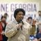 Georgia gubernatorial candidate Stacey Abrams answers questions from the crowd as she speaks during a visit to the Mack Gaston Community Center in Dalton, Ga., Friday, July 29, 2022. On Monday, Aug. 15, 2022, Abrams accused Republican Gov. Brian Kemp of trying to buy votes with a plan to make $350 payments to more than 3 million Georgians who benefit from Medicaid, subsidized child health insurance, food stamps or cash welfare. (Matt Hamilton/Chattanooga Times Free Press via AP, File)