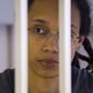 U.S. basketball player Brittney Griner looks through bars as she listens to the verdict standing in a cage in a courtroom in Khimki, outside Moscow, Russia, Thursday, Aug. 4, 2022. Griner&#39;s lawyers on Monday, Aug. 15, 2022, filed an appeal of her nine-year Russian prison sentence for drugs possession. Griner, a center for the Phoenix Mercury and a two-time Olympic gold medalist, was convicted on Aug. 4. She was arrested in February at Moscow&#39;s Sheremetyevo Airport after vape canisters containing cannabis oil were found in her luggage. (Evgenia Novozhenina/Pool Photo via AP, File)