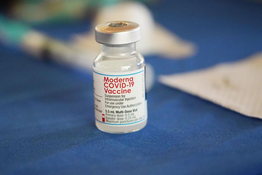A vial of Moderna COVID-19 vaccine rests on a table at an inoculation station next to Jackson State University in Jackson, Miss., on July 19, 2022. British health authorities have authorized an updated version of Moderna&#39;s coronavirus vaccine that aims to protect against the original virus and the omicron variant. (AP Photo/Rogelio V. Solis)