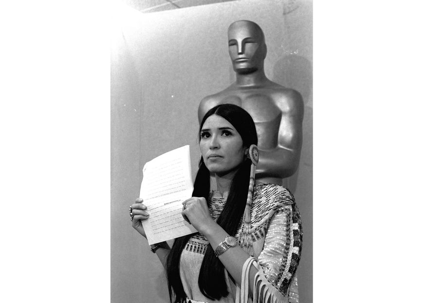 Sacheen Littlefeather appears at the Academy Awards ceremony to announce that Marlon Brando was declining his Oscar as best actor for his role in &amp;quot;The Godfather,&amp;quot; on March 27, 1973. The move was meant to protest Hollywood&#39;s treatment of American Indians. Nearly 50 years later, the Academy of Motion Pictures Arts and Sciences has apologized to Littlefeather for the abuse she endured. The Academy Museum of Motion Pictures on Monday said that it will host Littlefeather, now 75, for an evening of “conversation, healing and celebration” on Sept. 17. (AP Photo, File)