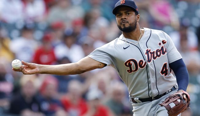 Detroit Tigers third baseman Jeimer Candelario throws out Cleveland Guardians&#x27; Amed Rosario at first base during the fifth inning in the first baseball game of a doubleheader, Monday, Aug. 15, 2022, in Cleveland. (AP Photo/Ron Schwane)