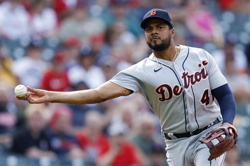 Detroit Tigers third baseman Jeimer Candelario throws out Cleveland Guardians&#x27; Amed Rosario at first base during the fifth inning in the first baseball game of a doubleheader, Monday, Aug. 15, 2022, in Cleveland. (AP Photo/Ron Schwane)