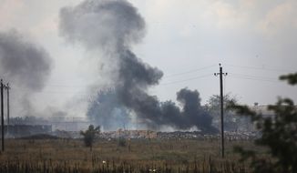 Smoke rises over the site of explosion at an ammunition storage of Russian army near the village of Mayskoye, Crimea, Tuesday, Aug. 16, 2022. Explosions and fires ripped through an ammunition depot in Russian-occupied Crimea on Tuesday in the second suspected Ukrainian attack on the peninsula in just over a week, forcing the evacuation of more than 3,000 people. (AP Photo)