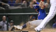 Chicago Cubs&#39; Nico Hoerner scores during the fourth inning of the team&#39;s baseball game against the Washington Nationals, Tuesday, Aug. 16, 2022, in Washington. (AP Photo/Nick Wass)