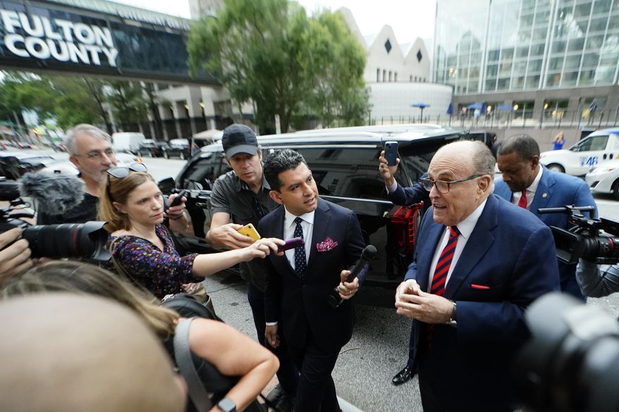 Rudy Giuliani arrives at the Fulton County Courthouse on Wednesday, Aug. 17, 2022, in Atlanta.  Giuliani is scheduled to testify before a special grand jury that is investigating attempts by former President Donald Trump and others to overturn his 2020 election defeat in Georgia. (AP Photo/John Bazemore)