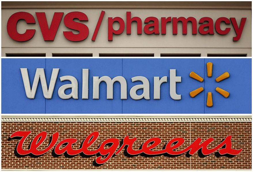This undated combination of file photos show the signs of CVS, Walmart and Walgreens. (AP Photo/File)