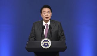 South Korean President Yoon Suk Yeol delivers a speech during a news conference to mark his first 100 days in office at the presidential office in Seoul, South Korea, Wednesday, Aug. 17, 2022. (Chung Sung-Jun/Pool Photo via AP)