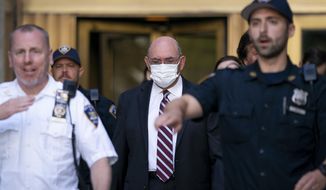 Law enforcement personnel escort the Trump Organization&#x27;s former Chief Financial Officer Allen Weisselberg, center, as he departs court, Friday, Aug. 12, 2022, in New York. Former President Donald Trump’s longtime finance chief is expected to plead guilty as soon as Thursday, Aug. 18 in a tax evasion case that is the only criminal prosecution to arise from a long-running investigation into the former president’s company, three people familiar with the matter told The Associated Press. (AP Photo/John Minchillo, File)