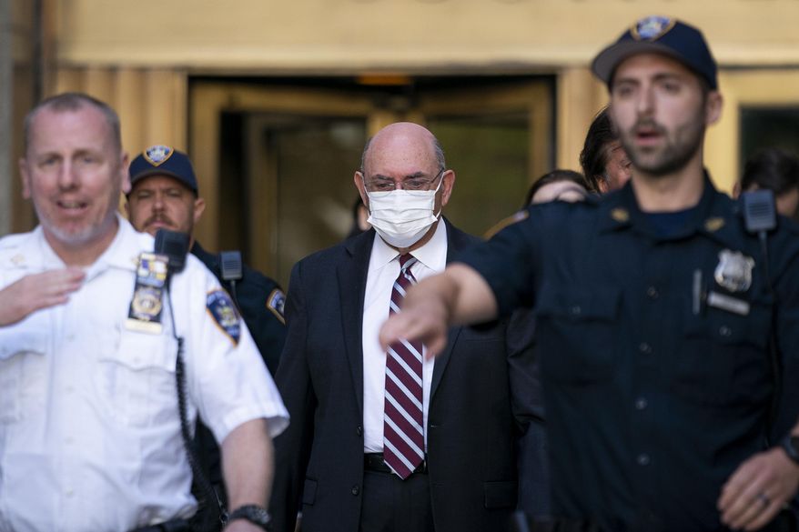 Law enforcement personnel escort the Trump Organization&#39;s former Chief Financial Officer Allen Weisselberg, center, as he departs court, Friday, Aug. 12, 2022, in New York. Former President Donald Trump’s longtime finance chief is expected to plead guilty as soon as Thursday, Aug. 18 in a tax evasion case that is the only criminal prosecution to arise from a long-running investigation into the former president’s company, three people familiar with the matter told The Associated Press. (AP Photo/John Minchillo, File)