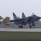 In this handout photo taken from video released by Russian Defense Ministry Press Service on Thursday, Aug. 18, 2022, a MiG-31 fighter jet of the Russian air force lands at the Chkalovsk air base in the Kaliningrad region. The Russian Defense Ministry said three MiG-31 fighters equipped to carry Kinzhal hypersonic missiles were deployed to the region as part of &amp;quot;additional measures of strategic deterrence.&amp;quot; (Russian Defense Ministry Press Service photo via AP)