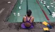 A 12-year-old transgender swimmer waits by a pool on Feb. 22, 2021, in Utah. Transgender kids in Utah will be not be subjected to sports participation limits at the start of the upcoming school year after a judge delayed the implementation of a statewide ban passed earlier this year. Judge Keith Kelly&#39;s decision Friday, Aug. 19, 2022, to put the law on hold until a legal challenges is resolved came after he recently rejected a request by Utah state attorneys to dismiss the case. (AP Photo/Rick Bowmer, File)