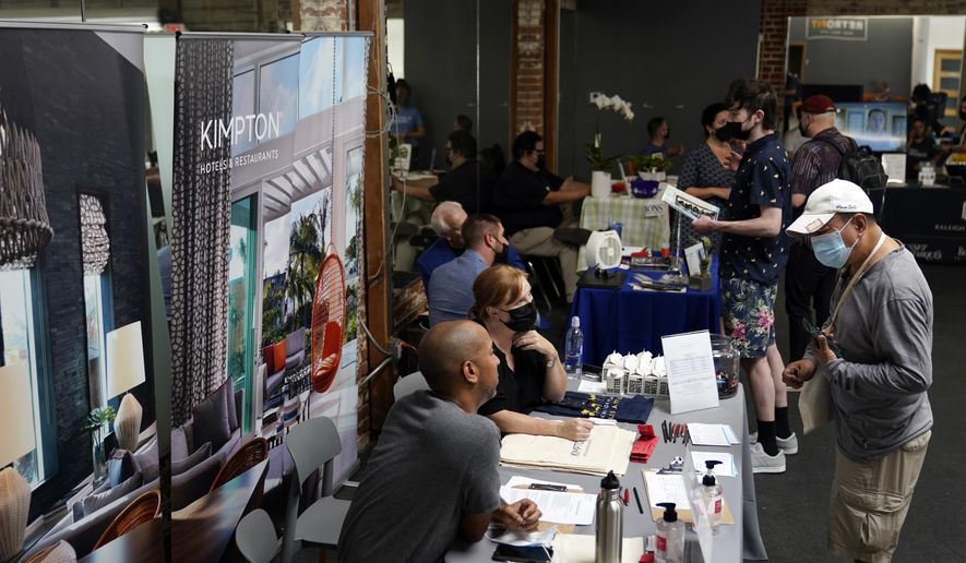 Prospective employers and job seekers interact during during a job fair on Sept. 22, 2021, in the West Hollywood section of Los Angeles. (AP Photo/Marcio Jose Sanchez, File)