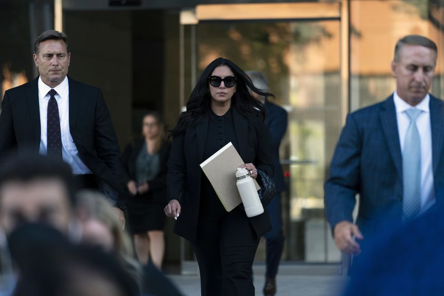 Vanessa Bryant, center, the widow of Kobe Bryant, leaves a federal courthouse in Los Angeles, Wednesday, Aug. 10, 2022. Kobe Bryant&#39;s widow is taking her lawsuit against the Los Angeles County sheriff&#39;s and fire departments to a federal jury, seeking compensation for photos deputies shared of the remains of the NBA star, his daughter and seven others killed in a helicopter crash in 2020. (AP Photo/Jae C. Hong)