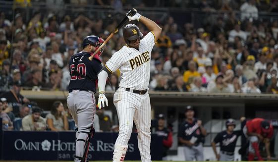 San Diego Padres&#39; Juan Soto throws his bat after striking out with the bases loaded to end the seventh inning of the team&#39;s baseball game against the Washington Nationals, Thursday, Aug. 18, 2022, in San Diego. (AP Photo/Gregory Bull)