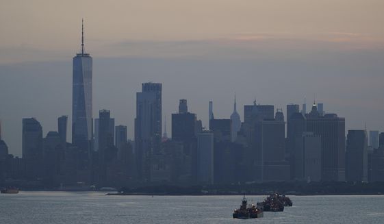 The New York City skyline is seen from New York Harbor in New York, Wednesday, June 30, 2021. (AP Photo/Seth Wenig, File)