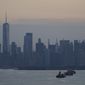 The New York City skyline is seen from New York Harbor in New York, Wednesday, June 30, 2021. (AP Photo/Seth Wenig, File)