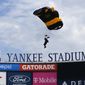 Members of the U.S. Army Golden Knights parachute into Yankee Stadium before a baseball game between the Toronto Blue Jays and the New York Yankees. Saturday, Aug. 20, 2022, in New York. (AP Photo/Noah K. Murray) **FILE**