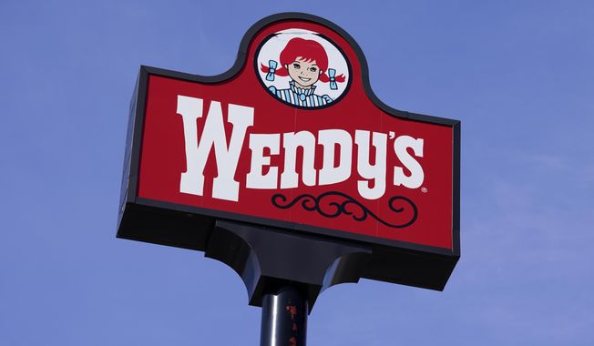 This Thursday, Feb. 25, 2021, photo shows a sign over a Wendy&#x27;s restaurant in Des Moines, Iowa. (AP Photo/Charlie Neibergall) **FILE**