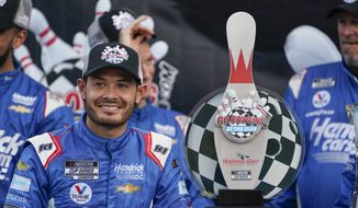 Kyle Larson smiles with his trophy after winning a NASCAR Cup Series auto race in Watkins Glen, N.Y., Sunday, Aug. 21, 2022. (AP Photo/Seth Wenig) **FILE**