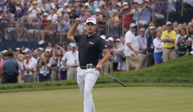 Patrick Cantlay reacts while watching his putt, which he missed, on the 18th hole during the final round of the BMW Championship golf tournament at Wilmington Country Club, Sunday, Aug. 21, 2022, in Wilmington, Del. (AP Photo/Julio Cortez)