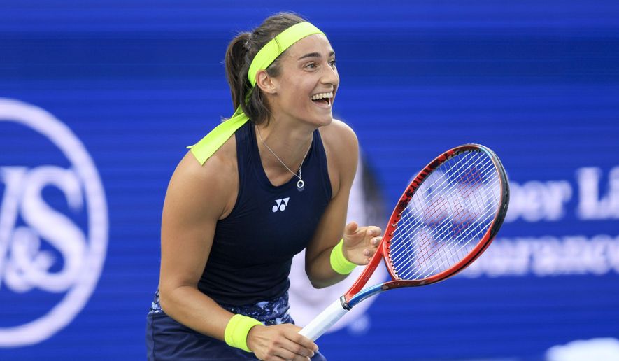 Caroline Garcia, of France, reacts as she defeats Petra Kvitova, of the Czech Republic, during the women&#39;s singles final of the Western &amp;amp; Southern Open tennis tournament, Sunday, Aug. 21, 2022, in Mason, Ohio. (AP Photo/Aaron Doster)