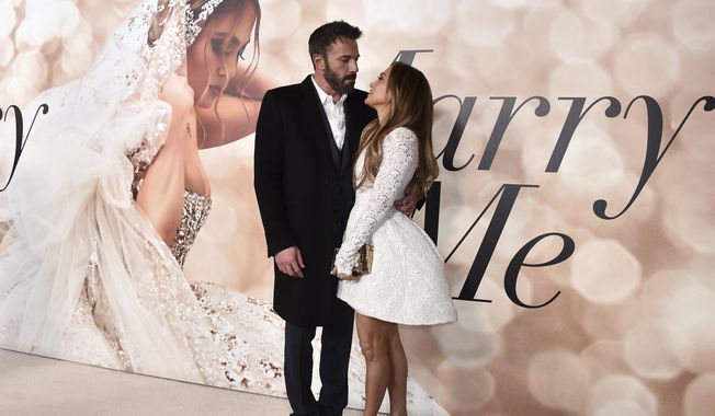 Cast member Jennifer Lopez, right, and Ben Affleck attend a photo call for a special screening of &amp;quot;Marry Me&amp;quot; at DGA Theater on Feb. 8, 2022, in Los Angeles. Lopez and Affleck said “I do” again this weekend. But instead of in a late night Las Vegas drive through chapel, this time it was in front of friends and family in Georgia, a person close to the couple who was not authorized to speak publicly said Sunday, Aug. 21, 2022. (Photo by Jordan Strauss/Invision/AP, File)